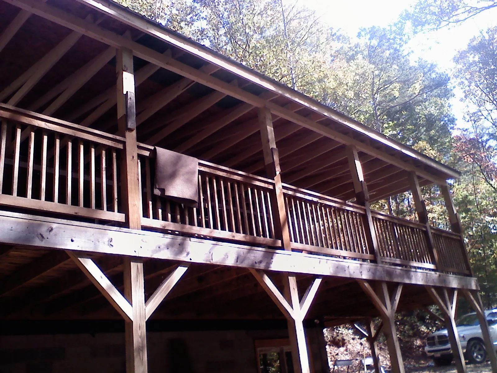 Timber framing under a new elevated porch and deck — Roof Leak Repair in Glen Cove by Roofing Brothers